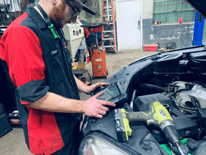A GLP Automotive technician uses a diagnostics machine to find problems with a car | auto repair