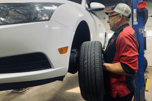 Don puts a tire on car at GLP Automotive in Lake Geneva, WI | Tires